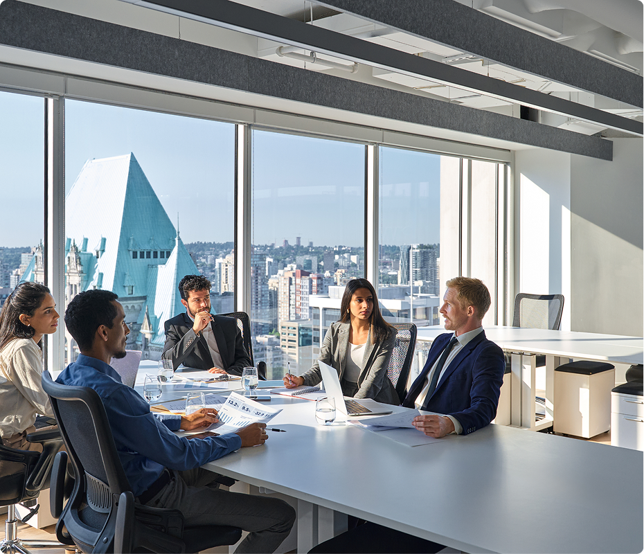 a group of young professionals in a meeting perennial accounting; a group of young professionals in a meeting